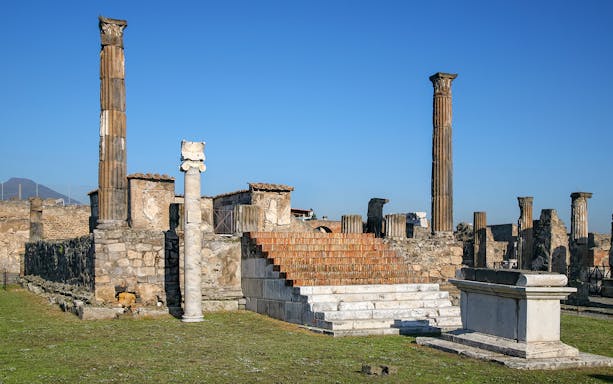 Temple of Apollo ruins with columns and altar, Pompeii, Italy.
