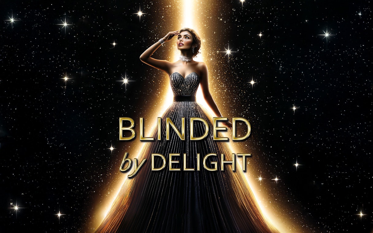 Performer in elegant gown under spotlight for BLINDED by DELIGHT Grand Show Berlin.