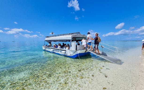 Tourists boarding a boat for a full day tour of Lady Musgrave Island.