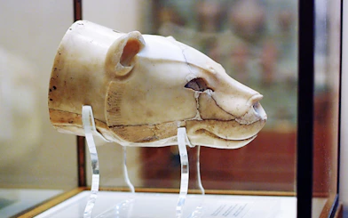 Ancient ivory lion head artifact at Heraklion Museum, Crete.