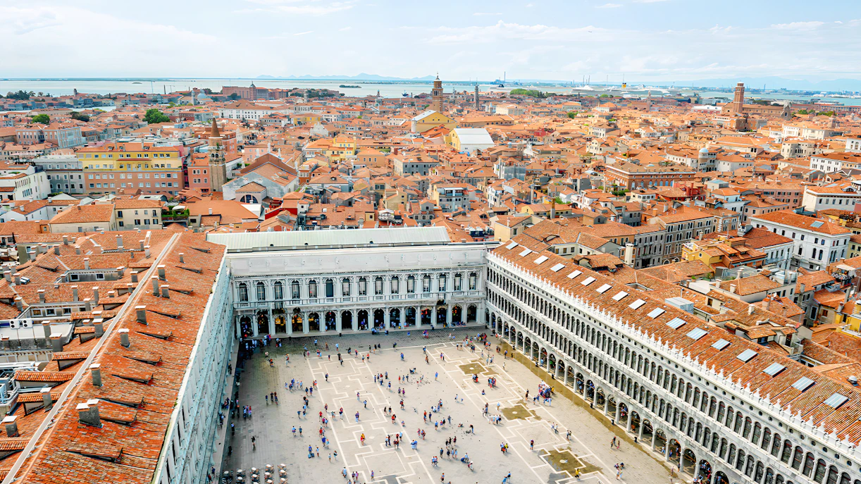 Doge's Palace and St. Mark's Basilica with view of St. Mark's Campanile in Venice.
