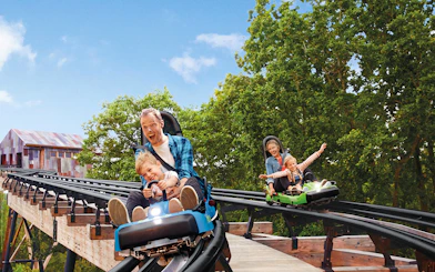 Families enjoying a roller coaster ride at Bellewaerde Theme Park, Ypres.