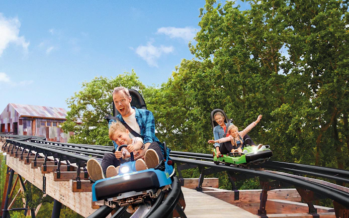 Families enjoying a roller coaster ride at Bellewaerde Theme Park, Ypres.