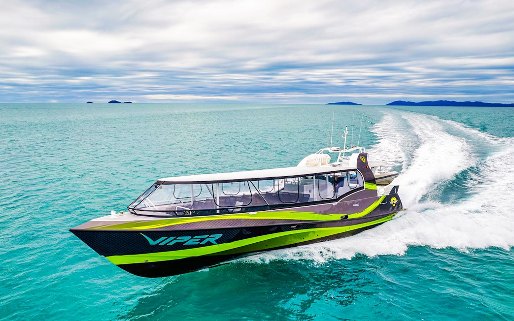 Viper boat cruising through turquoise waters in the Whitsundays.