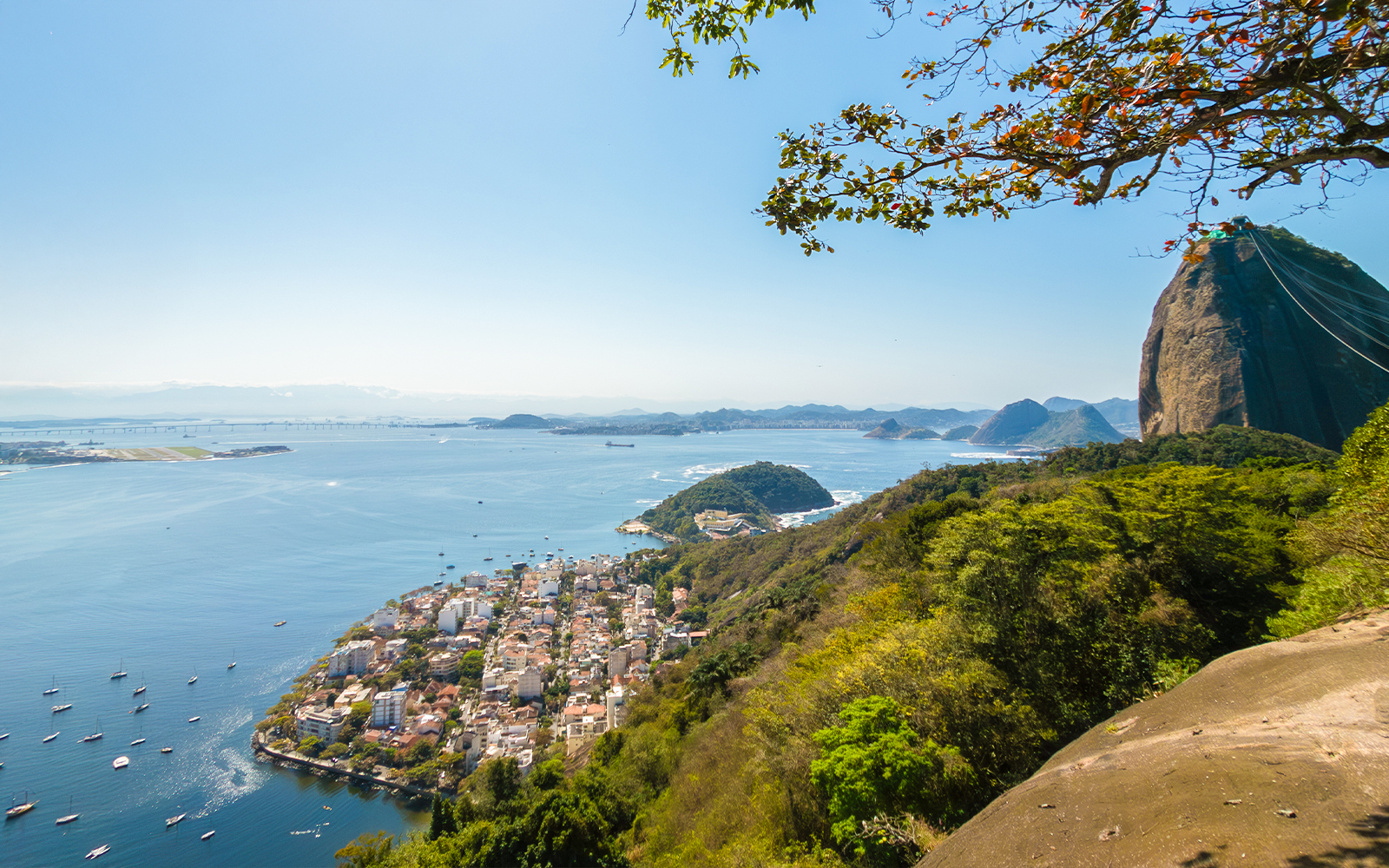 Panoramic view of Rio de Janeiro from Urca Hill with bay and mountains.