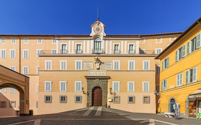 Facade of Castel Gandolfo with clock tower, Italy.