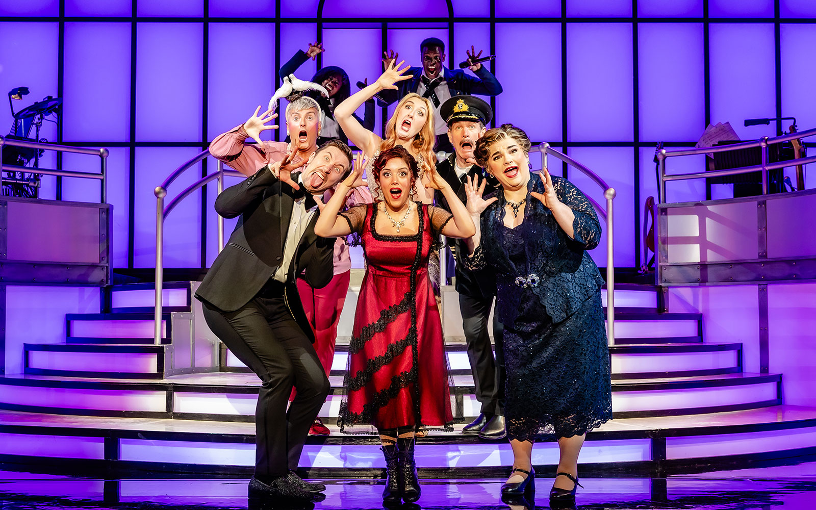 Cast performing on stage in Titanique West End show.