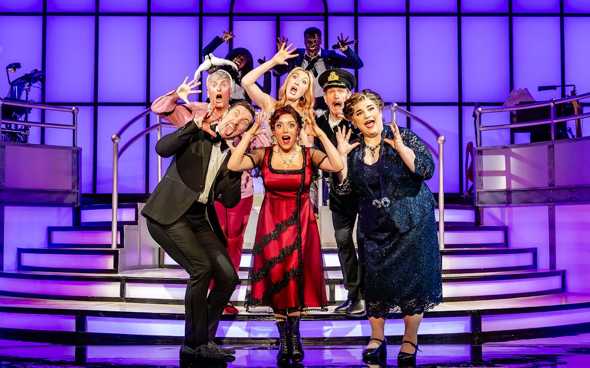 Cast performing on stage in Titanique West End show.