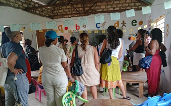 Visitors observing a classroom in a local village during the Diani: Giriama Cultural Dance Show and Tour.