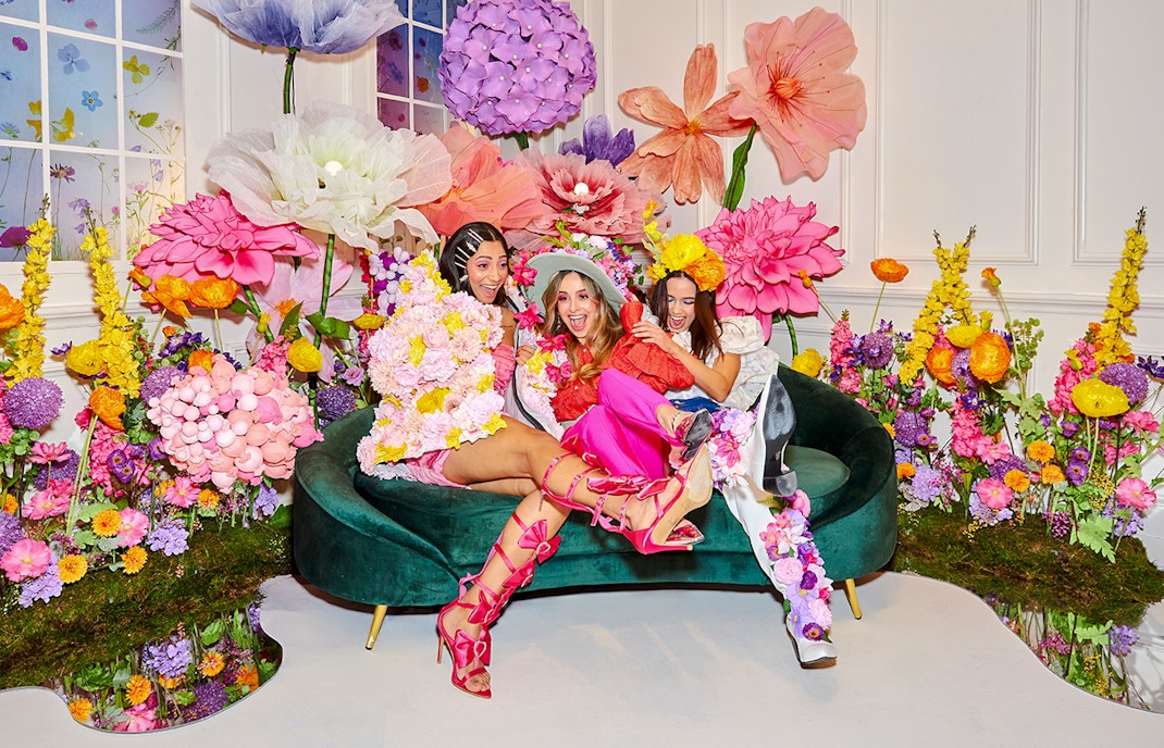 Guests enjoying vibrant floral decor at the WONDR Experience in Amsterdam.