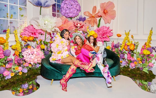 Guests enjoying vibrant floral decor at the WONDR Experience in Amsterdam.