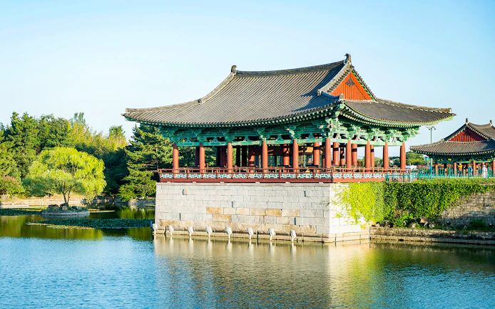 Traditional Korean pavilion by a pond in Gyeongju, South Korea, part of UNESCO World Heritage Tour.