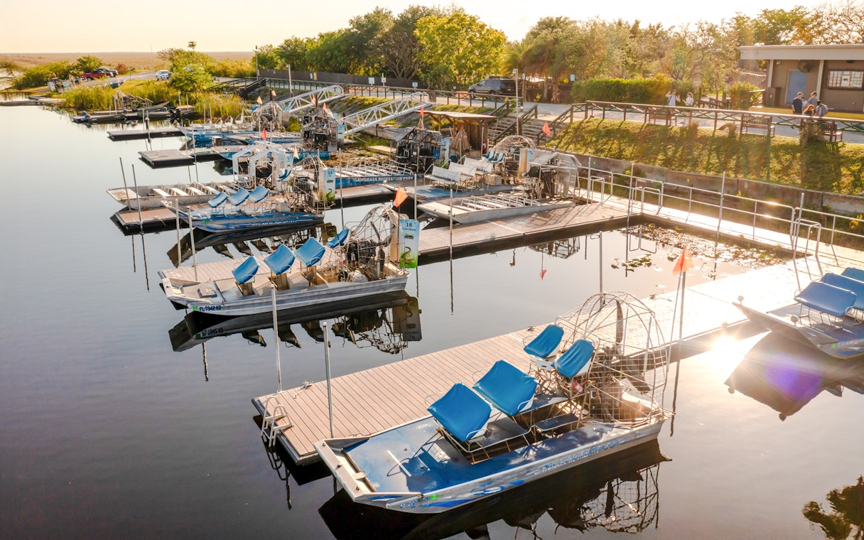Airboats docked at Everglades marina for private 1-hour adventure tour.