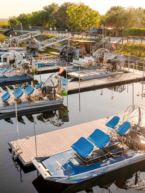 Airboats docked at Everglades marina for private 1-hour adventure tour.