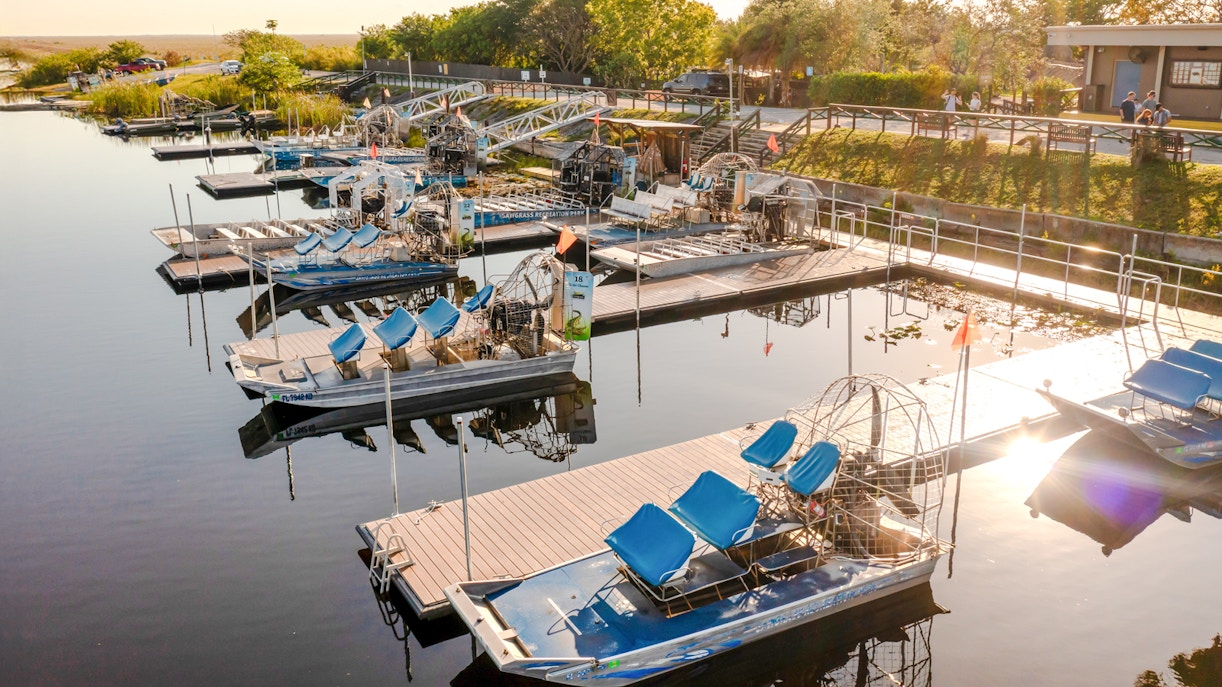 Airboats docked at Everglades marina for private 1-hour adventure tour.
