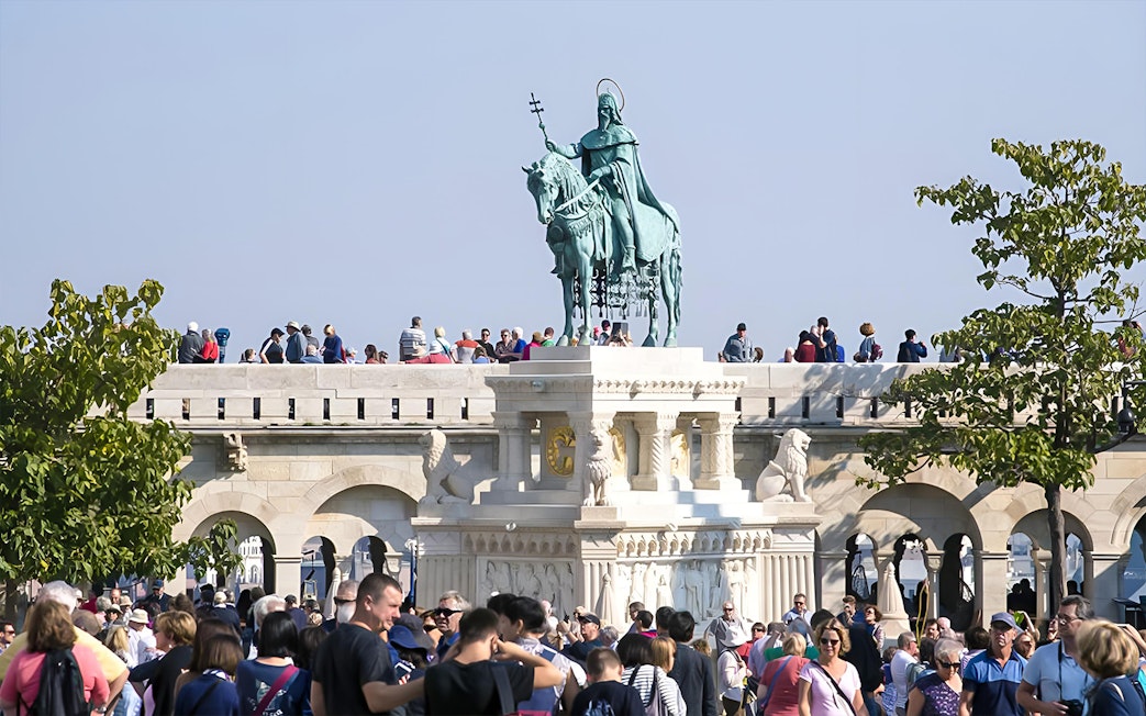 Crowd at Fisherman's Bastion with St. Stephen's statue, Budapest, on a guided walking tour.