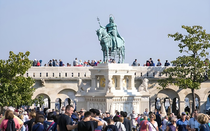 Crowd at Fisherman's Bastion with St. Stephen's statue, Budapest, on a guided walking tour.