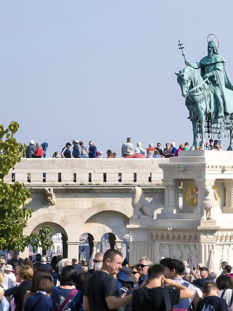 Crowd at Fisherman's Bastion with St. Stephen's statue, Budapest, on a guided walking tour.