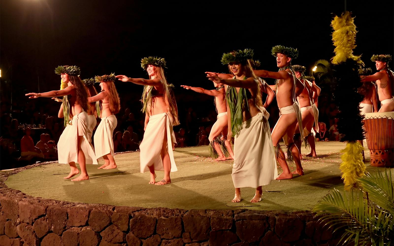 Traditional Hawaiian dancers performing at Old Lahaina Luau in Maui.