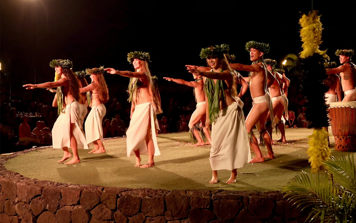 Traditional Hawaiian dancers performing at Old Lahaina Luau in Maui.