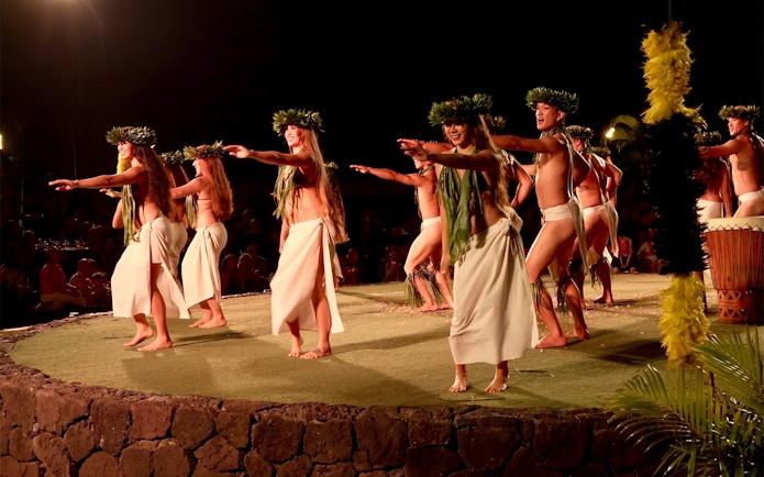 Traditional Hawaiian dancers performing at Old Lahaina Luau in Maui.