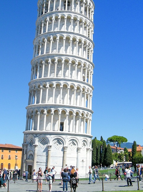 Leaning Tower of Pisa with tourists in Piazza dei Miracoli, Italy.