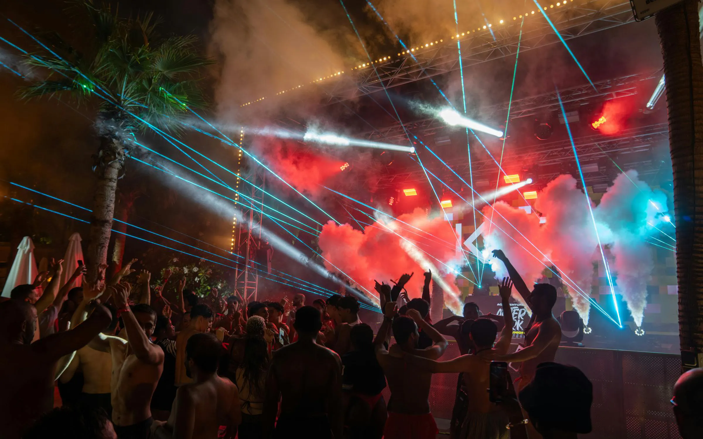 Crowd enjoying laser show and music at Aquaventure After Dark party.