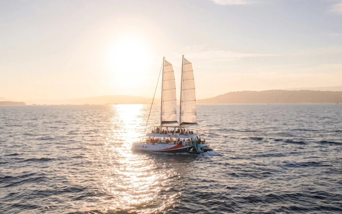 Catamaran sailing at sunset on the French Riviera.