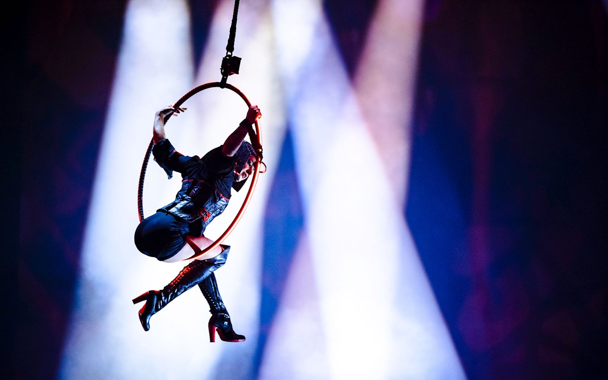 Performer on aerial hoop during House of Dancing Water show.