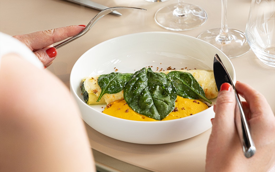 Lunch dish with spinach and sauce at Eiffel Tower's Madame Brasserie, Paris.