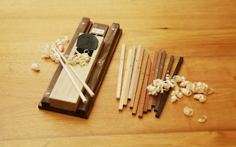 Chopstick-making tools and wood shavings at a workshop in Ginza.