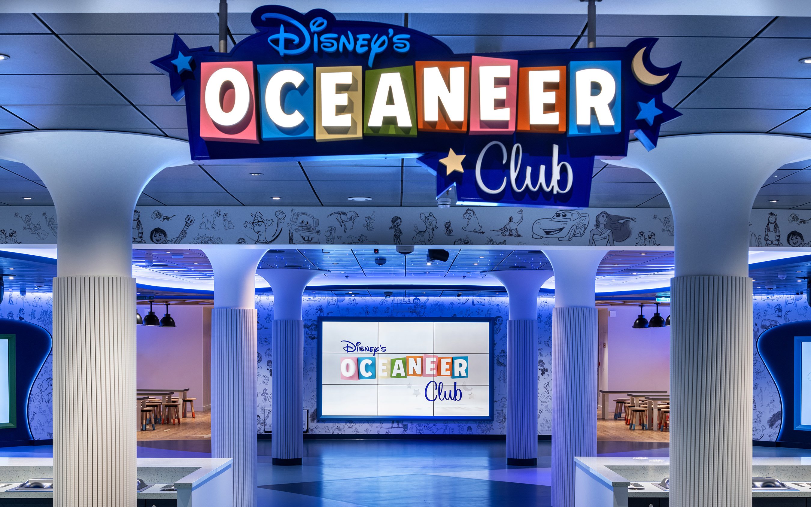 Disney Oceaneer Club entrance on Disney Cruise Line with colorful signage and themed decor.