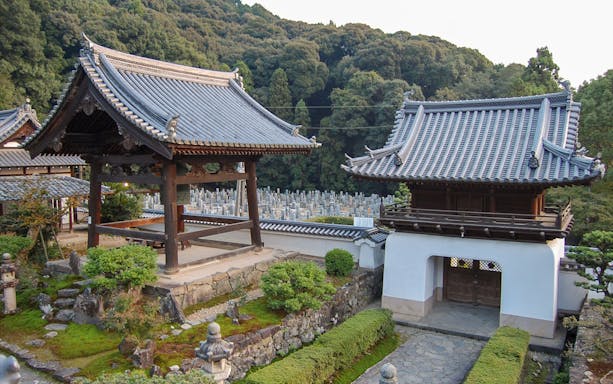 Kosho-ji Temple interior with people practicing Zazen meditation in Kyoto, Japan.