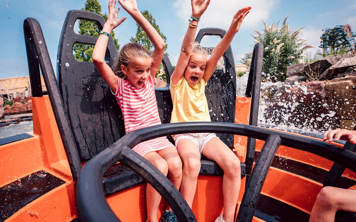Children enjoying a water ride at Efteling theme park near Amsterdam.