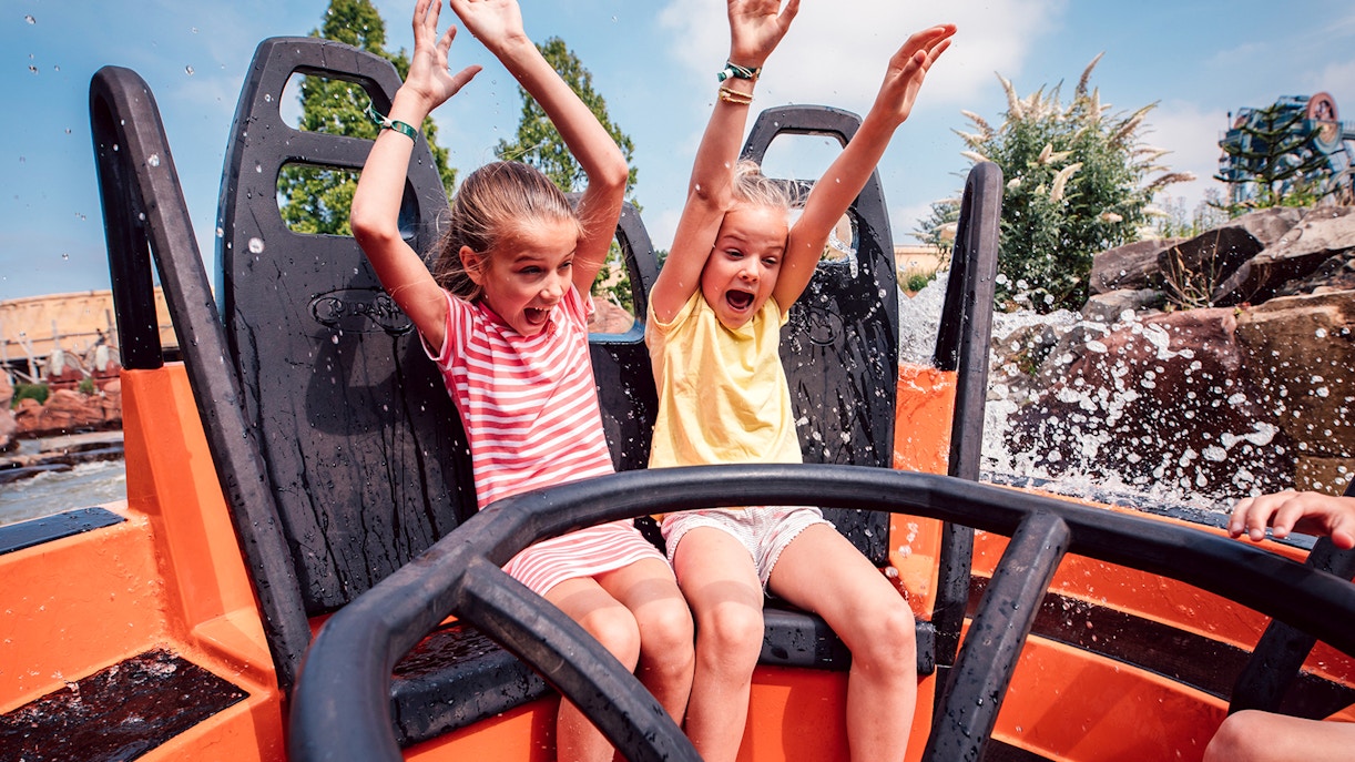 Children enjoying a water ride at Efteling theme park near Amsterdam.