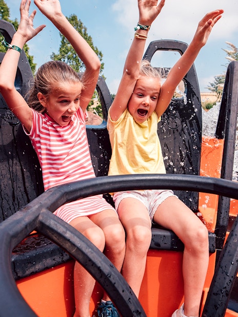 Children enjoying a water ride at Efteling theme park near Amsterdam.