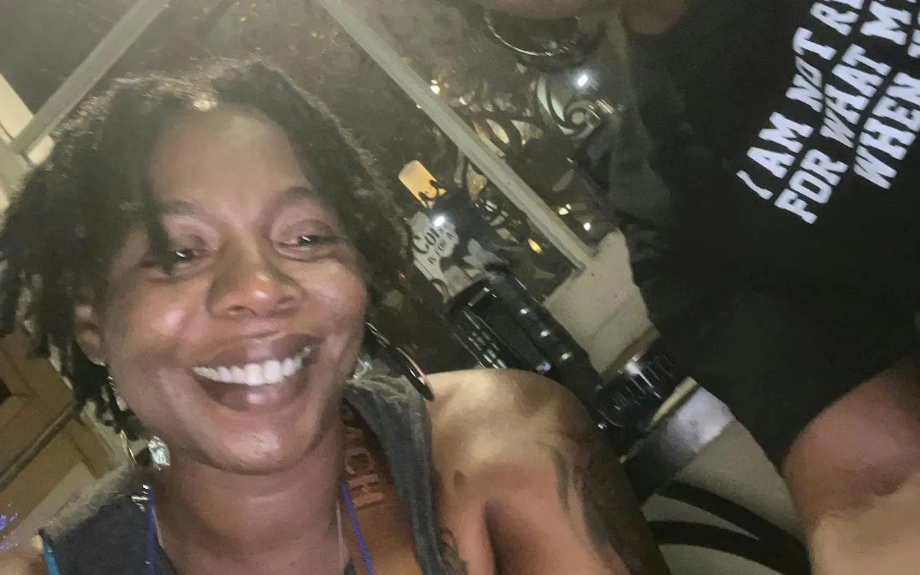 Smiling person enjoying a night out in New Orleans during the Shadow of the Voodoo Queen tour.