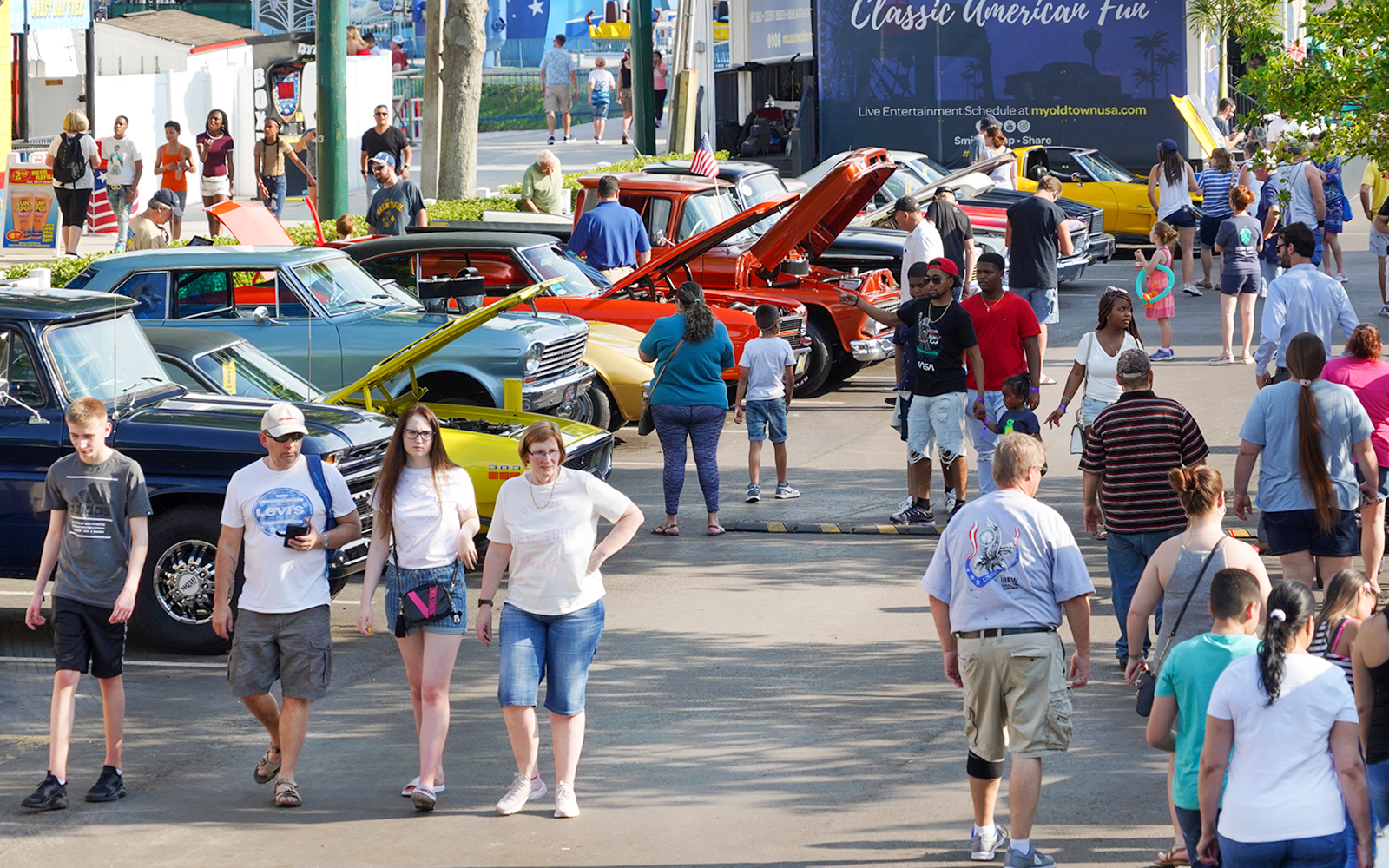 Crowd enjoying classic car show at Old Town, Orlando.