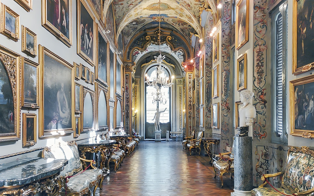 Doria Pamphilj Gallery interior with classic paintings and ornate decor in Rome, Italy.