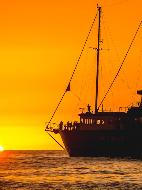 Cruise ship at sunset on Milford Sound overnight tour.