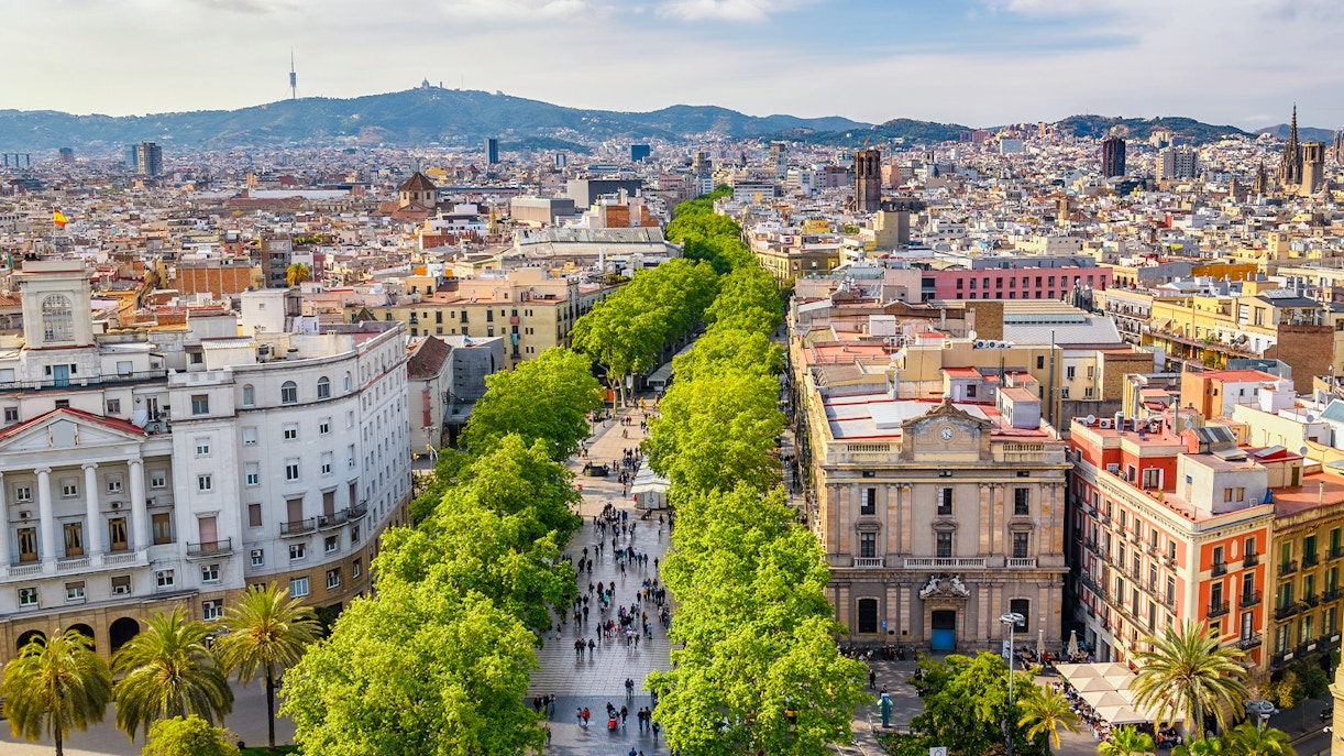 La Rambla Market Street Barcelona bustling with people and vibrant market stalls.