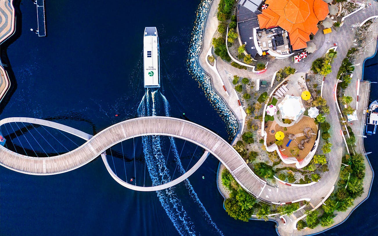 Aerial view of Elizabeth Quay Bridge and ferry in Perth, Australia.