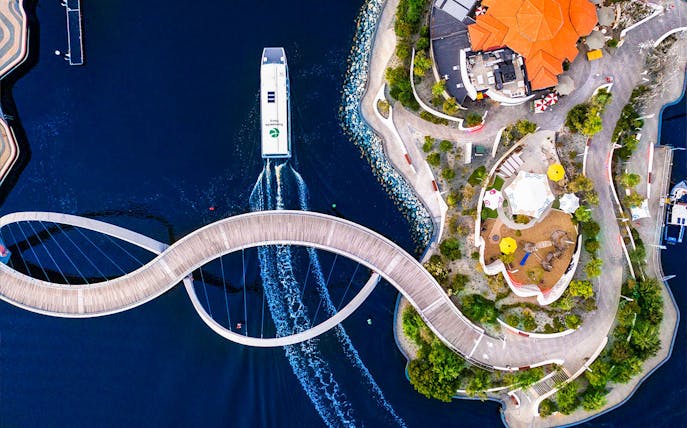 Aerial view of Elizabeth Quay Bridge and ferry in Perth, Australia.