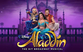 Aladdin Broadway musical characters on a magic carpet with a palace backdrop.