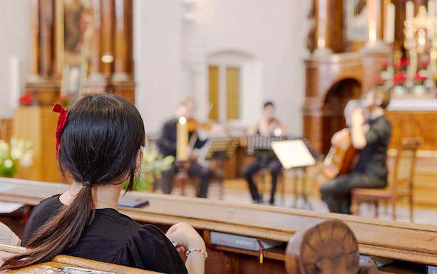 Audience watching a classical concert at Minoritenkirche, Vienna.