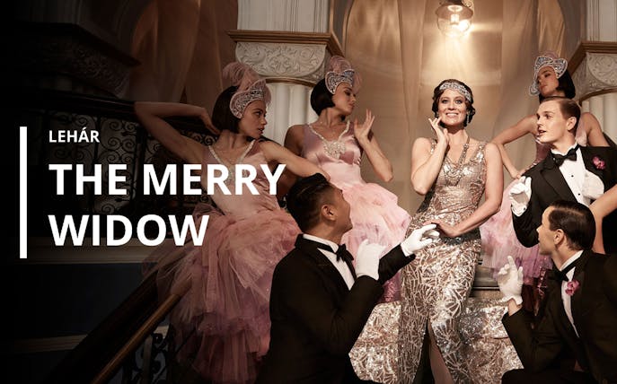 The Merry Widow poster with performers in elegant attire on a grand staircase.