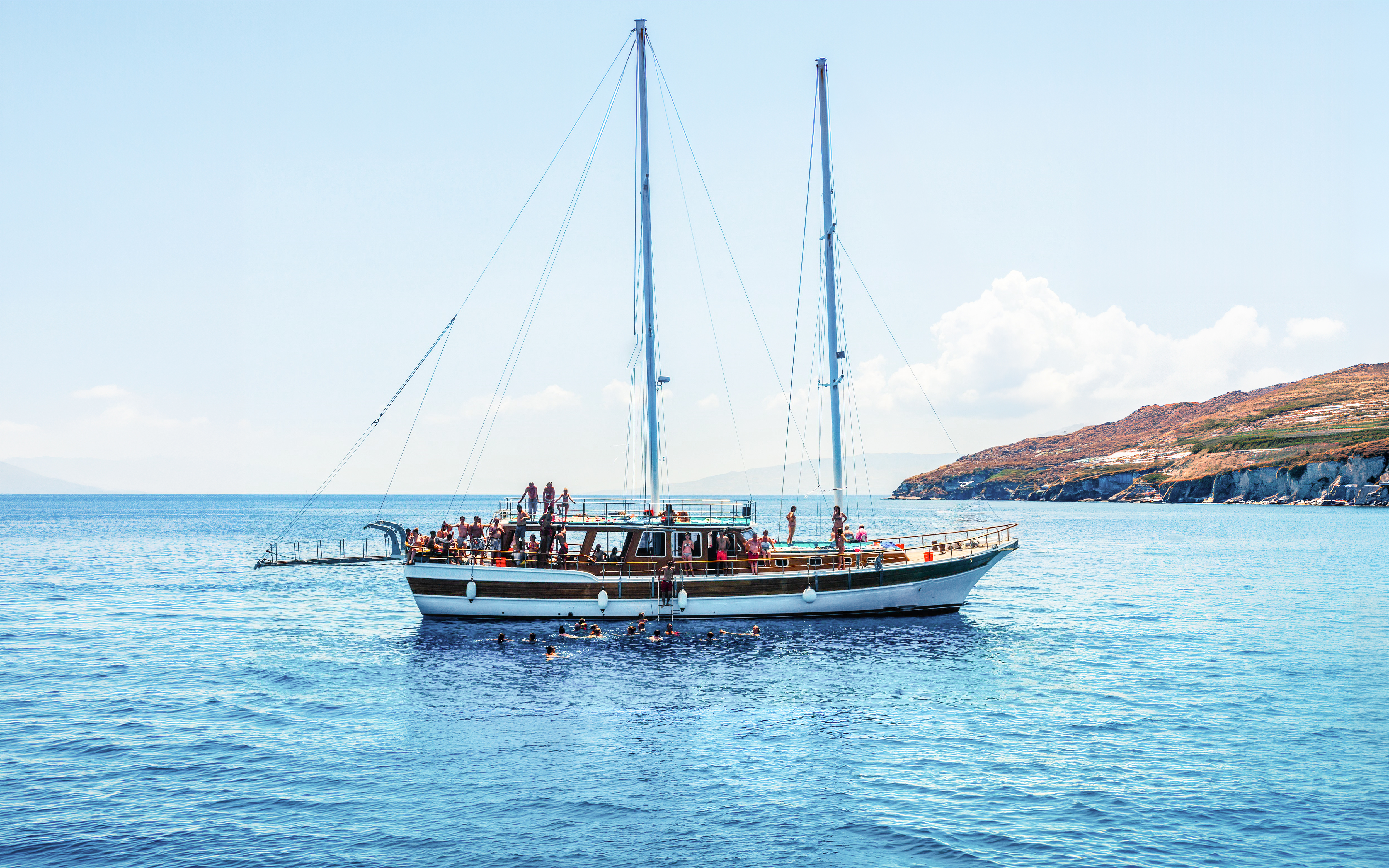 Sailing boat with tourists on an island hopping cruise near Athens, Greece.