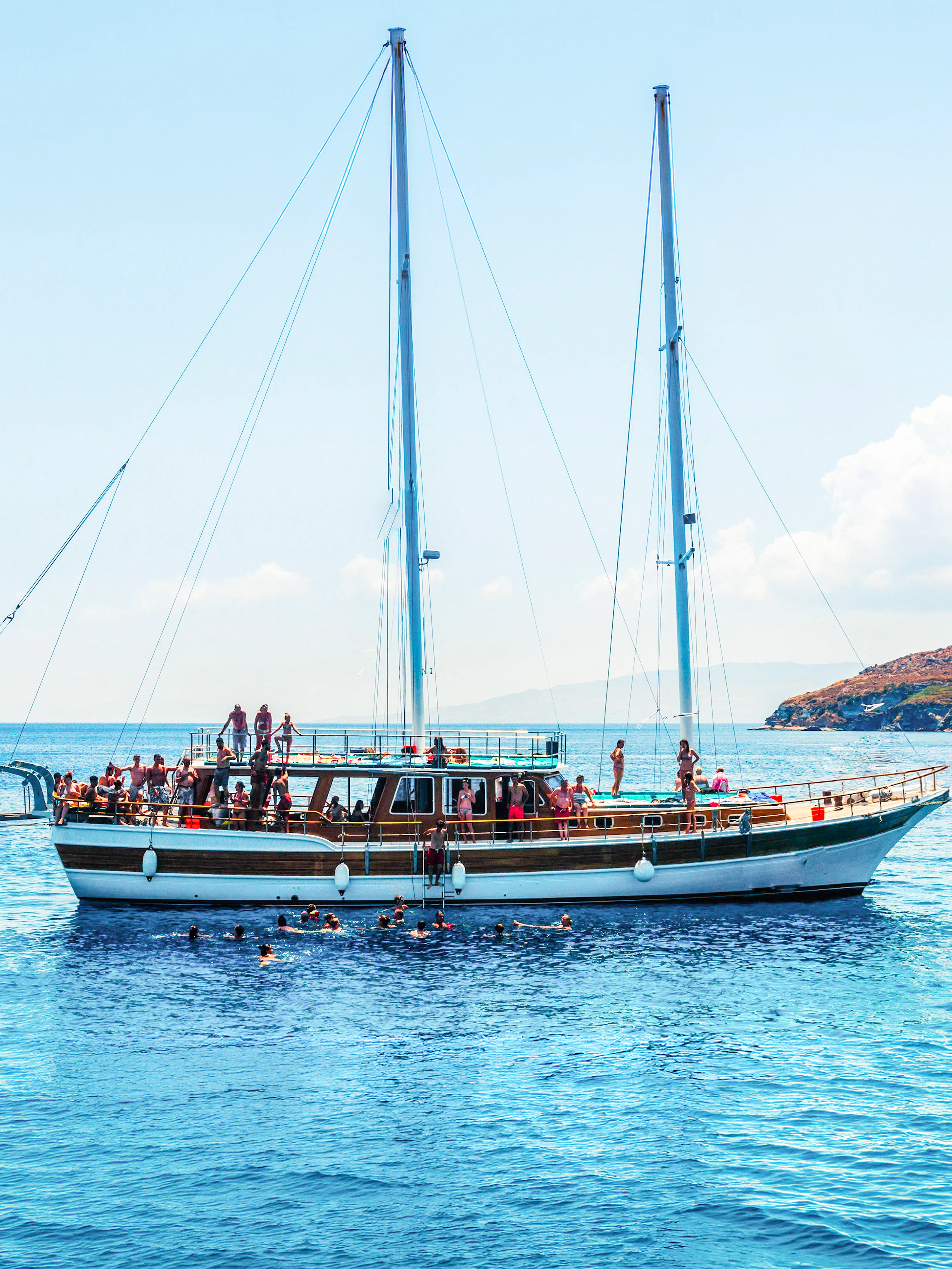 Sailing boat with tourists on an island hopping cruise near Athens, Greece.