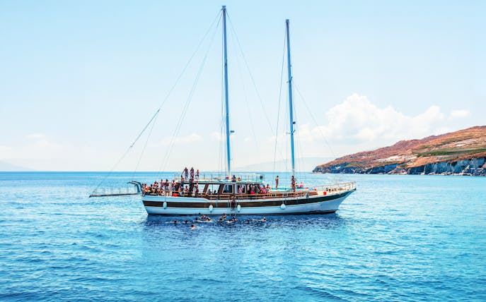Sailing boat with tourists on an island hopping cruise near Athens, Greece.
