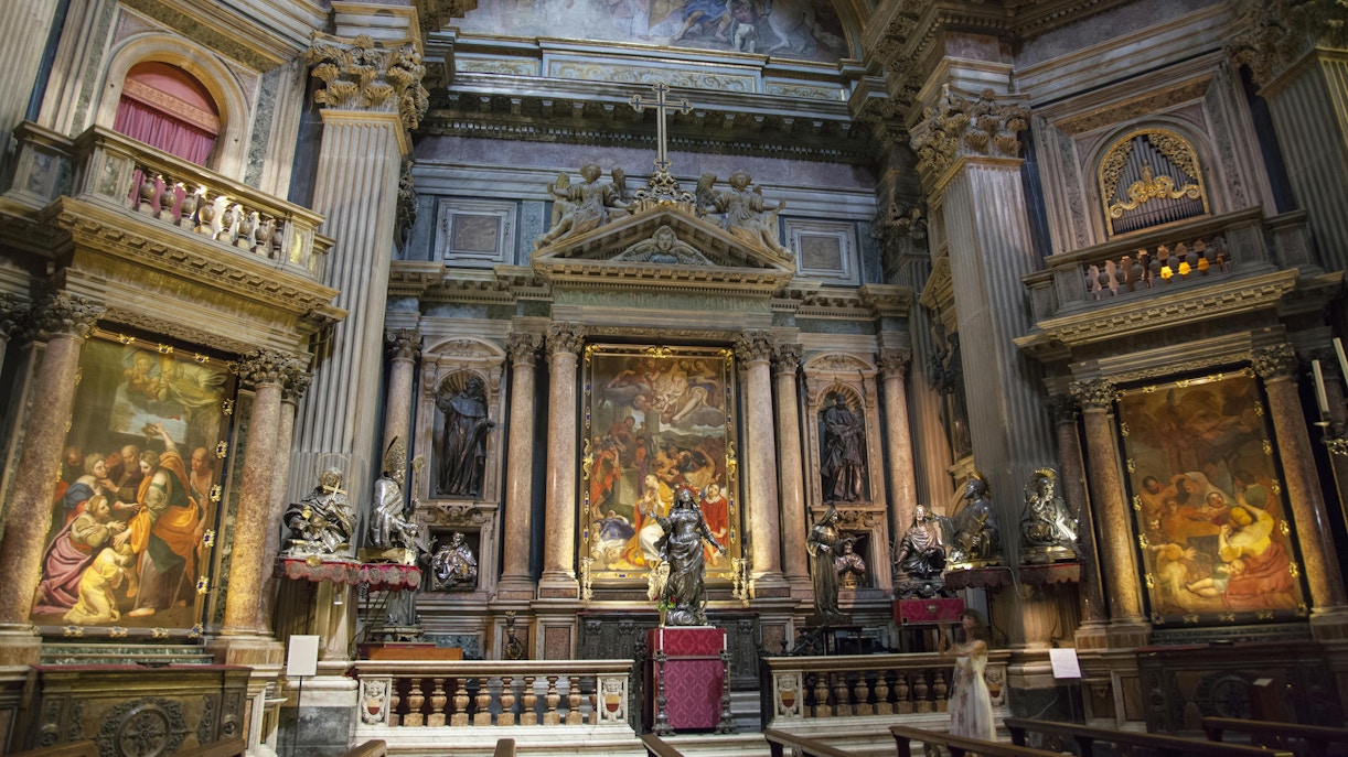 Royal Chapel of the Treasure of San Gennaro interior with ornate altar and religious paintings.